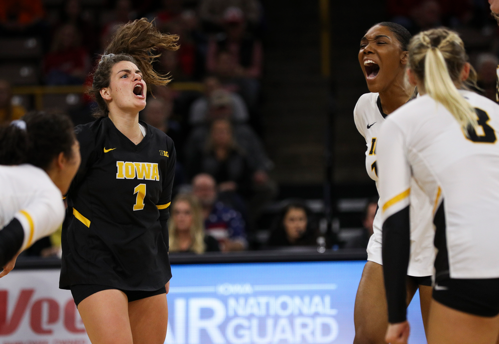 Iowa Hawkeyes defensive specialist Molly Kelly (1) and Iowa Hawkeyes outside hitter Taylor Louis (16) celebrate after winning a point during a match against Nebraska at Carver-Hawkeye Arena on November 7, 2018. (Tork Mason/hawkeyesports.com)