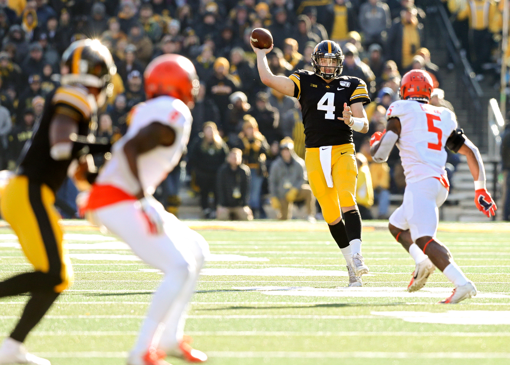 Iowa Hawkeyes quarterback Nate Stanley (4) throws on the run during the fourth quarter of their game at Kinnick Stadium in Iowa City on Saturday, Nov 23, 2019. (Stephen Mally/hawkeyesports.com)