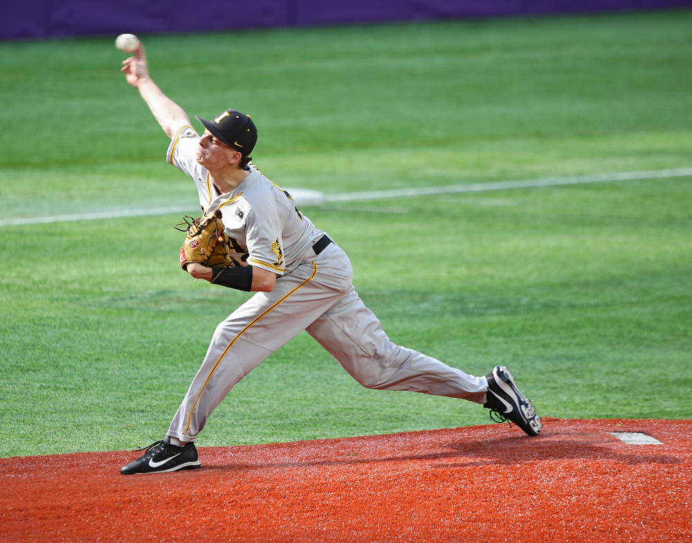 Iowa Hawkeyes pitcher Drew Irvine (12) delivers to the plate during the seventh inning of their CambriaCollegeClassic game at U.S. Bank Stadium in Minneapolis, Minn. on Friday, February 28, 2020. (Stephen Mally/hawkeyesports.com)