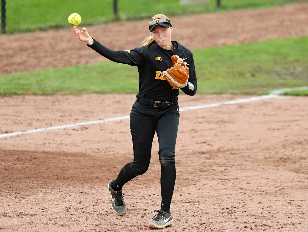 Iowa third baseman Ashley Hamilton (18) throws to first for an out during the sixth inning of their game against Iowa Softball vs Indian Hills Community College at Pearl Field in Iowa City on Sunday, Oct 6, 2019. (Stephen Mally/hawkeyesports.com)