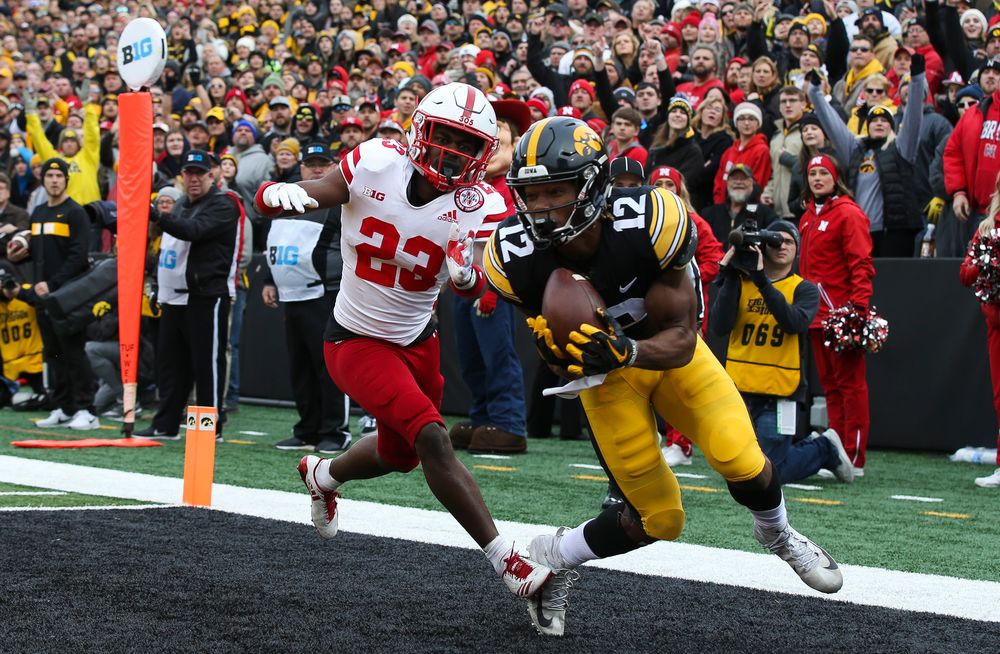 Iowa Hawkeyes wide receiver Brandon Smith (12) makes a touchdown catch during a game against Nebraska at Kinnick Stadium on November 23, 2018. (Tork Mason/hawkeyesports.com)