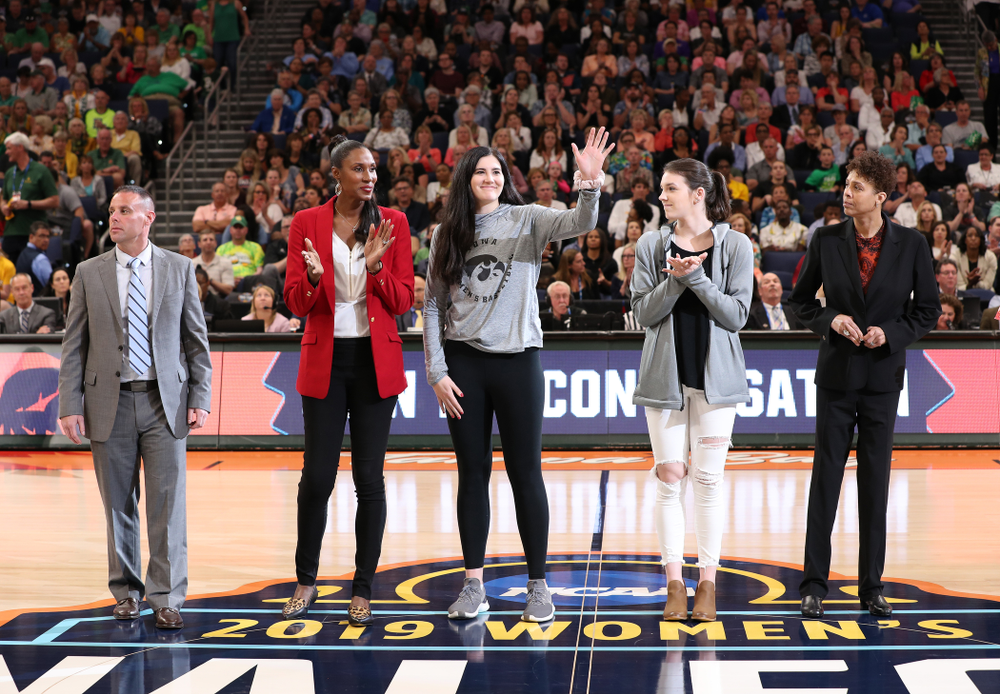 Iowa Hawkeyes forward Megan Gustafson (10) is introduced with Lisa Leslie and the other members of the Naismith Starting 5 during a timeout in the second half of the National Semi-Final between Baylor and Oregon Friday, April 5, 2019 at Amalie Arena in Tampa, FL. (Brian Ray/hawkeyesports.com)