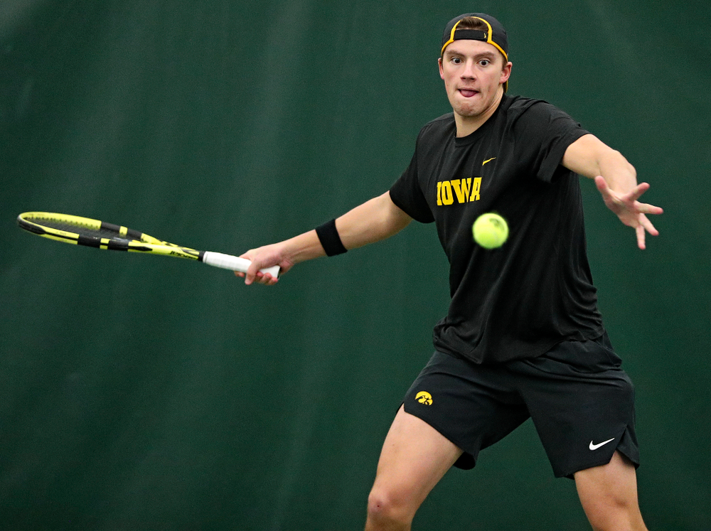 Iowa’s Joe Tyler returns a shot during their match at the Hawkeye Tennis and Recreation Complex in Iowa City on Thursday, January 16, 2020. (Stephen Mally/hawkeyesports.com)