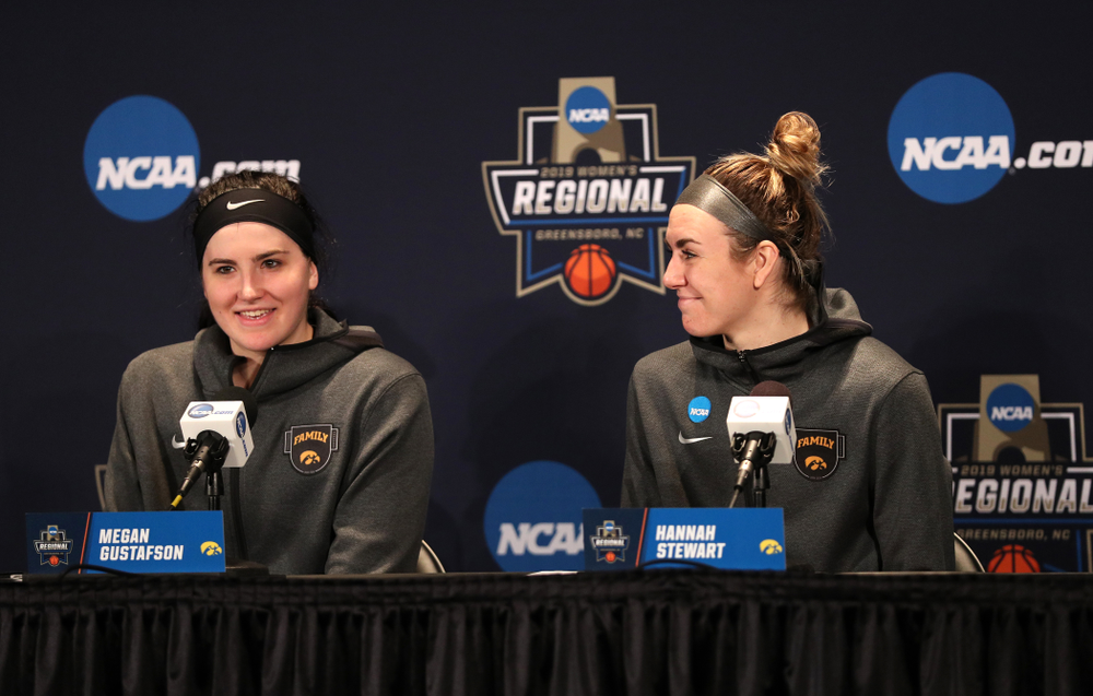 Iowa Hawkeyes forward Megan Gustafson (10) and forward Hannah Stewart (21) against the NC State Wolfpack in the regional semi-final of the 2019 NCAA Women's College Basketball Tournament Saturday, March 30, 2019 at Greensboro Coliseum in Greensboro, NC.(Brian Ray/hawkeyesports.com)