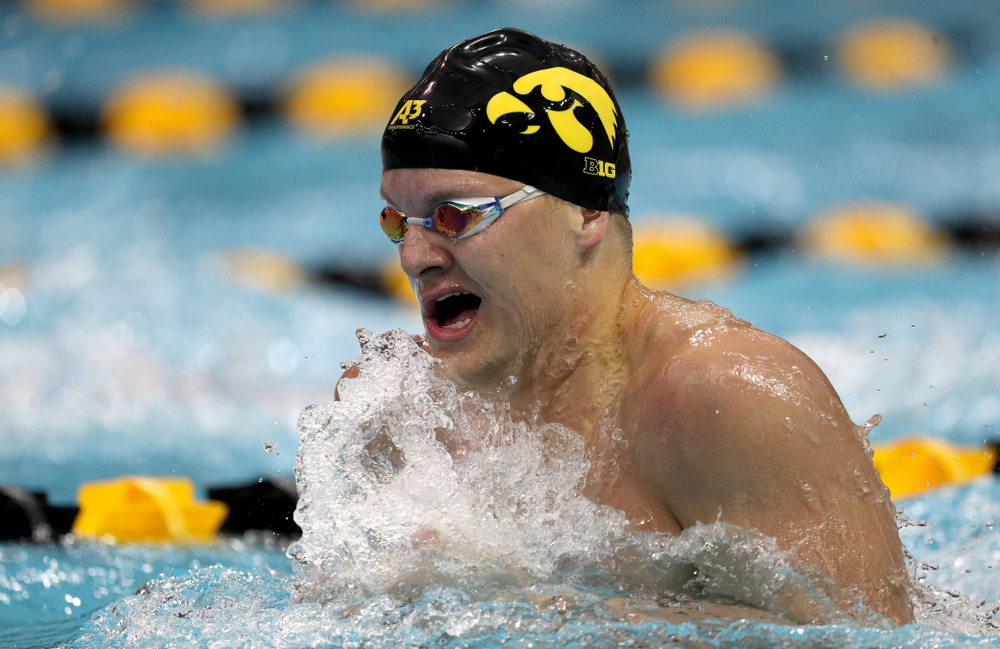IowaÕs Will Myhre competes in the 100 yard breaststroke against Notre Dame and Illinois Saturday, January 11, 2020 at the Campus Recreation and Wellness Center. (Brian Ray/hawkeyesports.com)