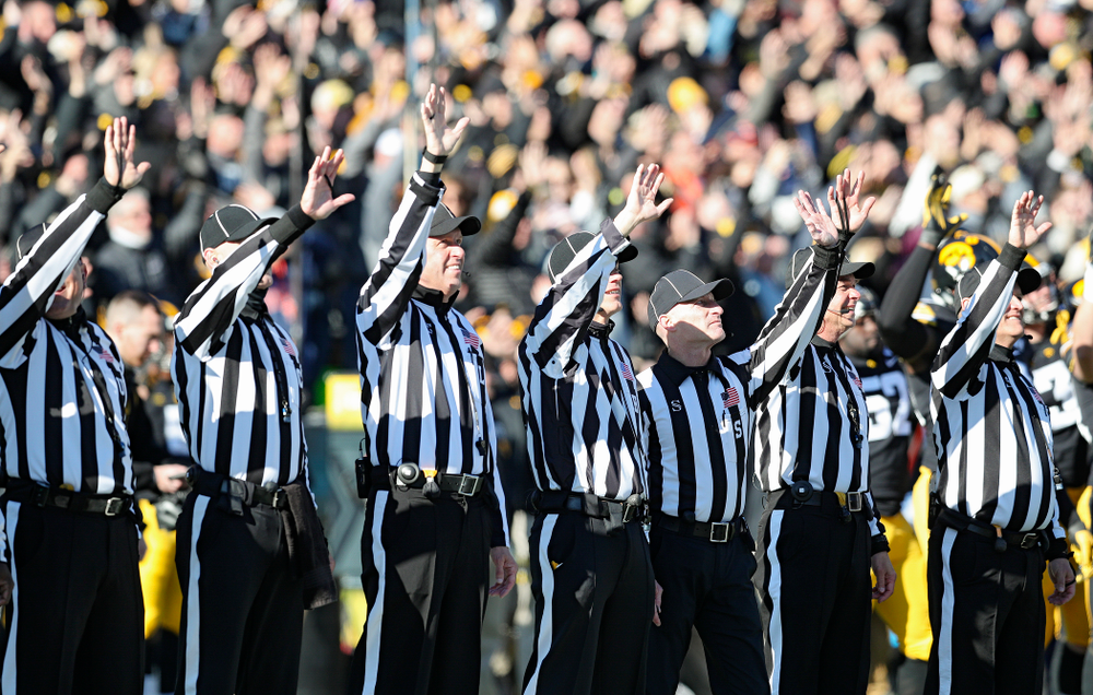 Officials wave to the University of Iowa Stead Family Children's Hospital between the first and second quarter of their game at Kinnick Stadium in Iowa City on Saturday, Nov 23, 2019. (Stephen Mally/hawkeyesports.com)