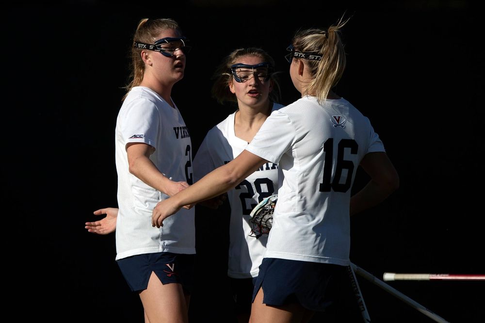 STANFORD, California - FEBRUARY 14: Virginia Cavaliers midfield Sammy Mueller (2) is congratulated by midfield Nora Bowen (28) and midfield Ashlyn McGovern (16) after scoring a goal against the Stanford Cardinal during the first half at Cagan Stadium on February 14, 2020 in Stanford, California. The Virginia Cavaliers defeated the Stanford Cardinal 12-11. (Photo by Jason O. Watson)