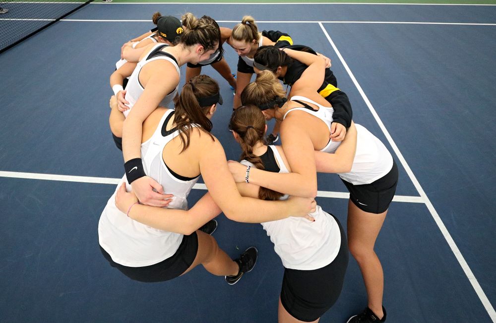 The Hawkeyes huddle before their match at the Hawkeye Tennis and Recreation Complex in Iowa City on Sunday, February 23, 2020. (Stephen Mally/hawkeyesports.com)