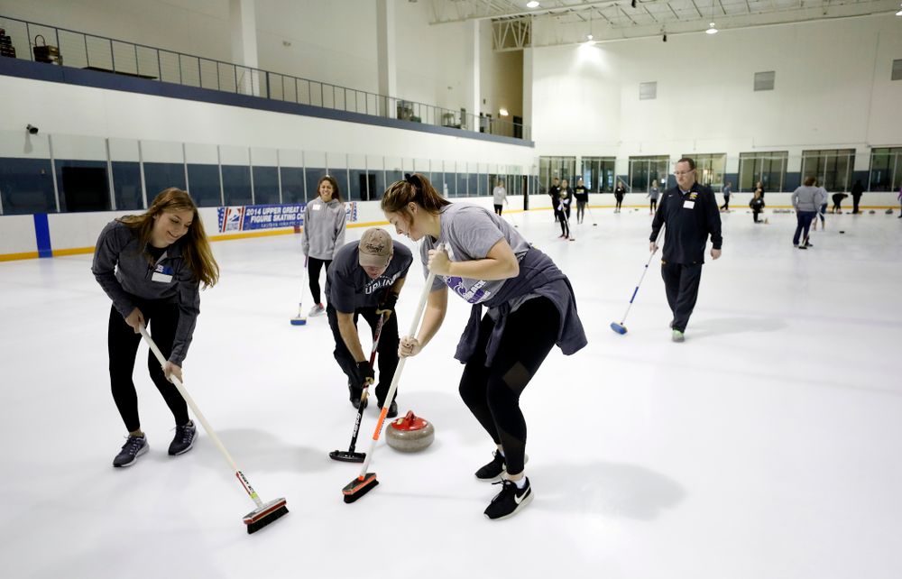 Members of the Iowa Softball team learn the sport of curling as part of a team building event Wednesday, January 10, 2018 at the Cedar Rapids Ice Arena. (Brian Ray/hawkeyesports.com)