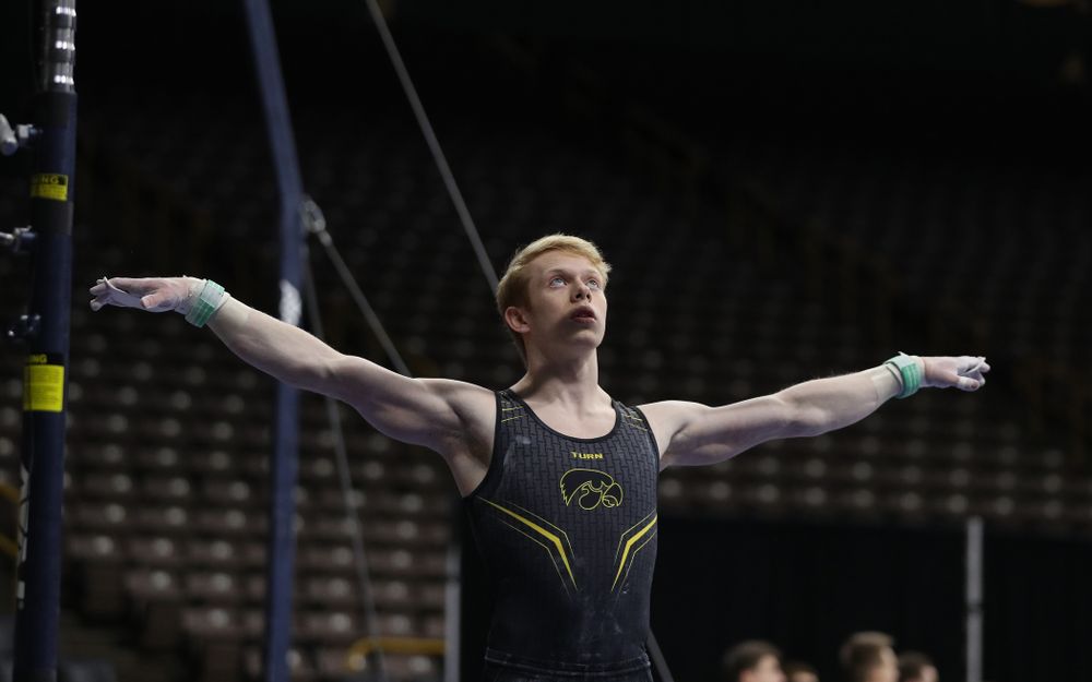 Iowa's Nick Merryman competes on the high bar against the Ohio State Buckeyes Saturday, March 16, 2019 at Carver-Hawkeye Arena. (Brian Ray/hawkeyesports.com)
