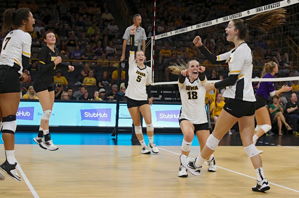 Iowa’s Meghan Buzzerio (5) and Hannah Clayton (18) celebrate with Courtney Buzzerio (2) after her kill during their Big Ten/Pac-12 Challenge match at Carver-Hawkeye Arena in Iowa City on Saturday, Sep 7, 2019. (Stephen Mally/hawkeyesports.com)