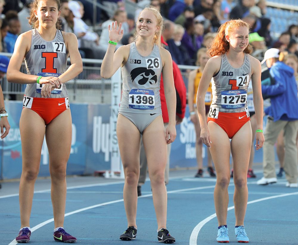 Iowa's Kylie Latham waves to someone in the stands before running the women's 10,000 meter event during the first day of the Drake Relays at Drake Stadium in Des Moines on Thursday, Apr. 25, 2019. (Stephen Mally/hawkeyesports.com)
