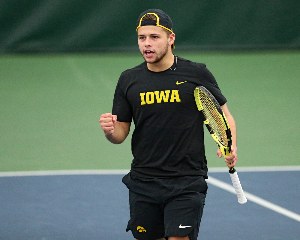 Iowa’s Will Davies celebrates a point during their doubles match against Marquette at the Hawkeye Tennis and Recreation Complex in Iowa City on Saturday, January 25, 2020. (Stephen Mally/hawkeyesports.com)