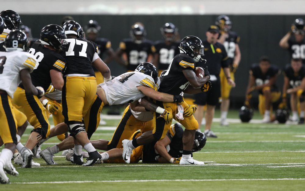 Iowa Hawkeyes running back Mekhi Sargent (10) and linebacker Kristian Welch (34) During Fall Camp Practice No. 6 Thursday, August 8, 2019 at the Ronald D. and Margaret L. Kenyon Football Practice Facility. (Brian Ray/hawkeyesports.com)