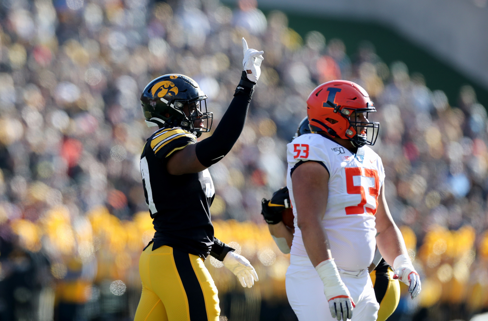 Iowa Hawkeyes defensive end Chauncey Golston (57) waves a finger after batting down a pass against the Illinois Fighting Illini Saturday, November 23, 2019 at Kinnick Stadium. (Brian Ray/hawkeyesports.com)