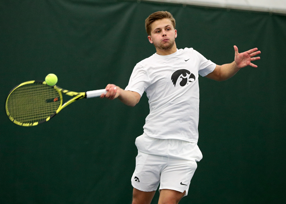 Iowa’s Will Davies returns a shot during his singles match at the Hawkeye Tennis and Recreation Complex in Iowa City on Sunday, February 16, 2020. (Stephen Mally/hawkeyesports.com)