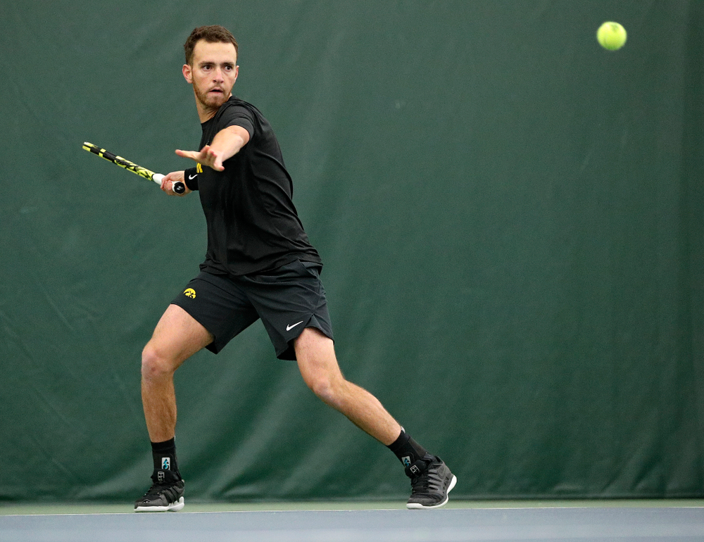 Iowa’s Kareem Allaf hits a shot during his match against Marquette at the Hawkeye Tennis and Recreation Complex in Iowa City on Saturday, January 25, 2020. (Stephen Mally/hawkeyesports.com)