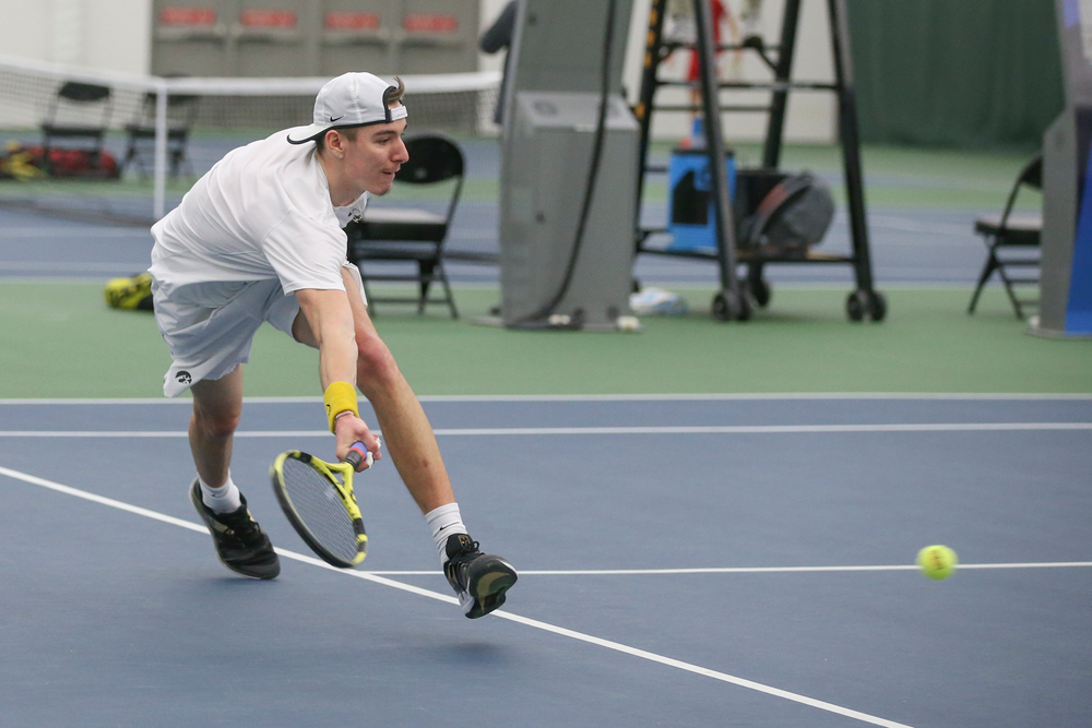 Iowa’s Nikita Snezhko returns a hit during the Iowa men’s tennis meet vs Nebraska on Sunday, March 1, 2020 at the Hawkeye Tennis and Recreation Complex. (Lily Smith/hawkeyesports.com)