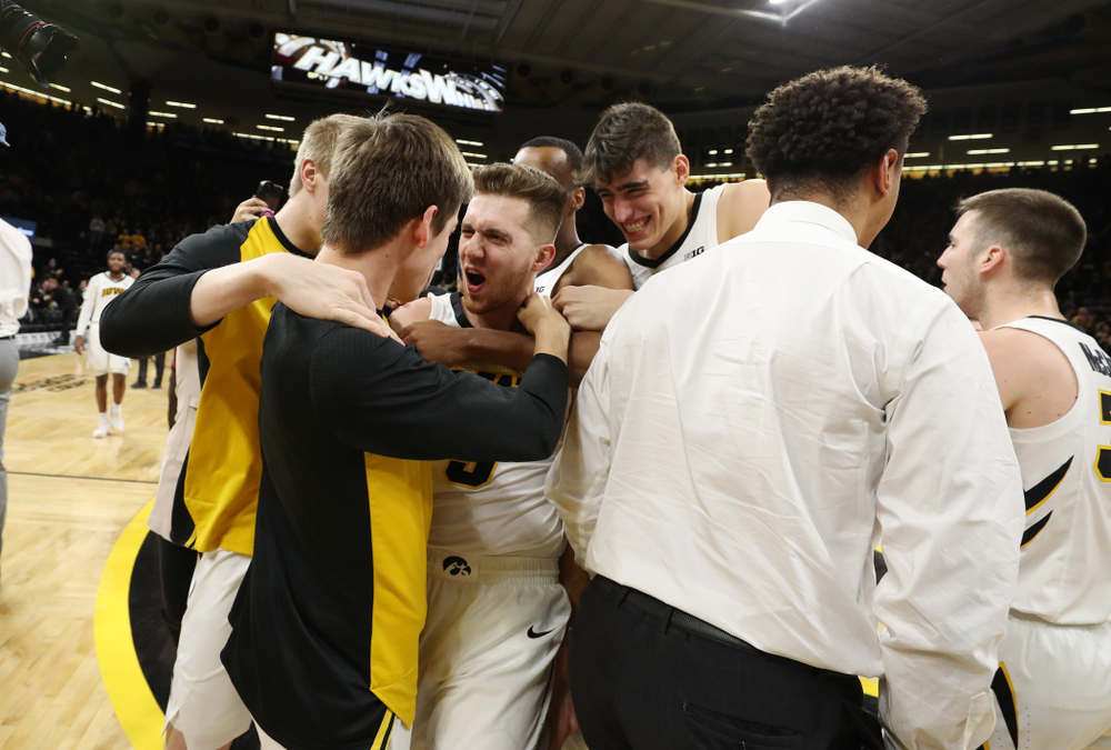 Iowa Hawkeyes guard Jordan Bohannon (3) celebrates with his teammates after making the game winning three point basket against the Northwestern Wildcats Sunday, February 10, 2019 at Carver-Hawkeye Arena. (Brian Ray/hawkeyesports.com)