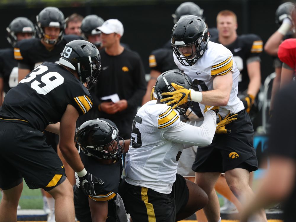 Iowa Hawkeyes defensive lineman Cedrick Lattimore (95) and linebacker Nick Niemann (49) during practice No. 4 of Fall Camp Monday, August 6, 2018 at the Hansen Football Performance Center. (Brian Ray/hawkeyesports.com)