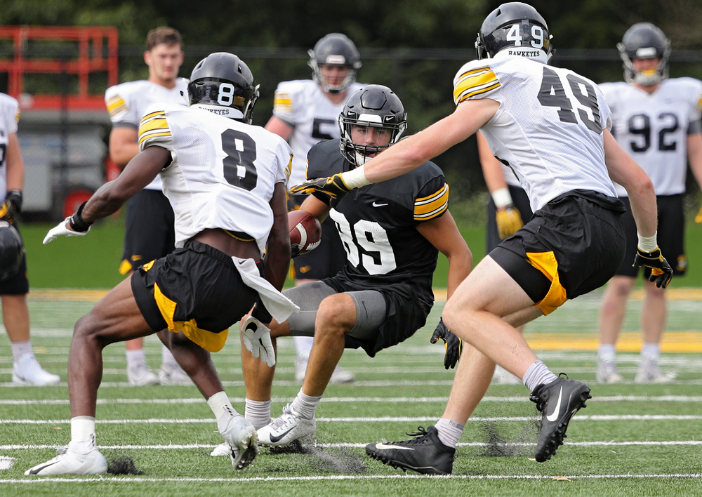 Iowa Hawkeyes wide receiver Nico Ragaini (89) eyes Iowa Hawkeyes defensive back Matt Hankins (8) and linebacker Nick Niemann (49) during Fall Camp Practice No. 15 at the Hansen Football Performance Center in Iowa City on Monday, Aug 19, 2019. (Stephen Mally/hawkeyesports.com)
