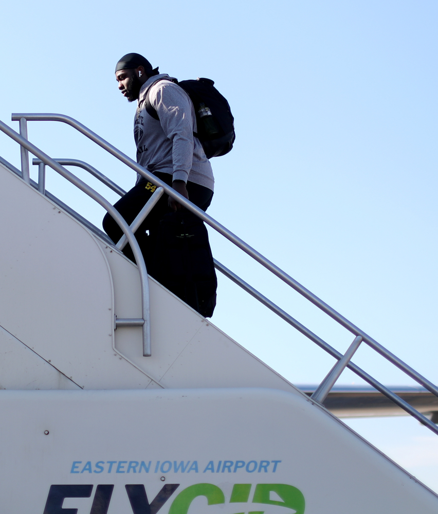 Iowa Hawkeyes defensive tackle Daviyon Nixon (54) boards the team plane at the Eastern Iowa Airport Saturday, December 21, 2019 on the way to San Diego, CA for the Holiday Bowl. (Brian Ray/hawkeyesports.com)