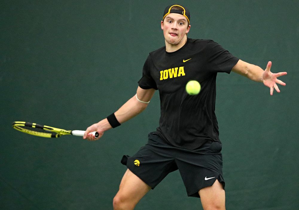 Iowa’s Joe Tyler hits a shot during his match against Marquette at the Hawkeye Tennis and Recreation Complex in Iowa City on Saturday, January 25, 2020. (Stephen Mally/hawkeyesports.com)