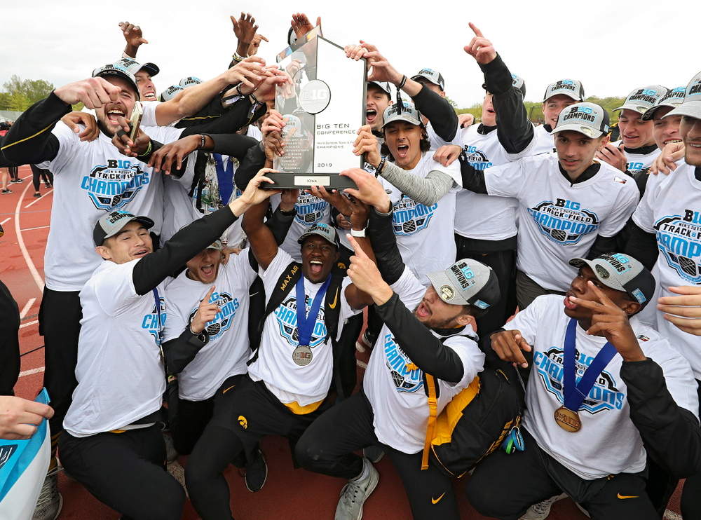The Hawkeyes hold up their team trophy after winning the Men's Big Ten Outdoor Track and Field Championships on the third day of the Big Ten Outdoor Track and Field Championships at Francis X. Cretzmeyer Track in Iowa City on Sunday, May. 12, 2019. (Stephen Mally/hawkeyesports.com)