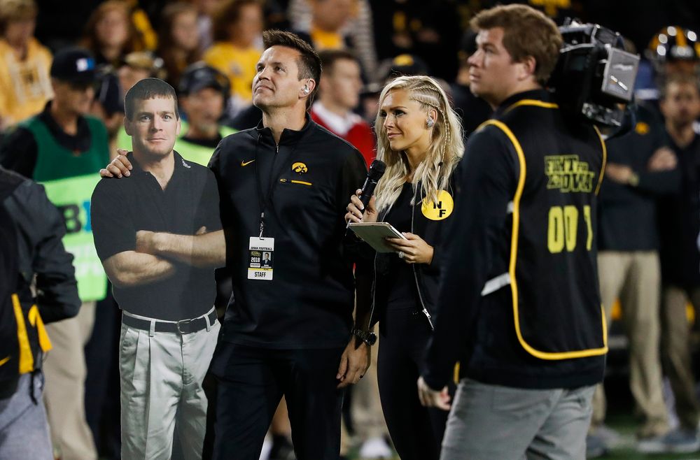 Iowa Hawkeyes volleyball head coach Bond Shymansky addresses the crowd in a timeout during a game against Wisconsin at Kinnick Stadium on September 22, 2018. (Tork Mason/hawkeyesports.com)
