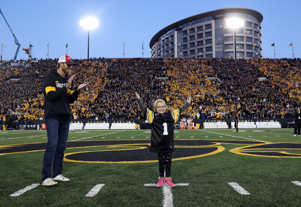 Honorary Captain Ricky Stanzi and Stead Family ChildrenÕs Hospital Kid Captain Gabby Yoder before the Iowa Hawkeyes game against the Penn State Nittany Lions Saturday, October 12, 2019 at Kinnick Stadium. (Brian Ray/hawkeyesports.com)
