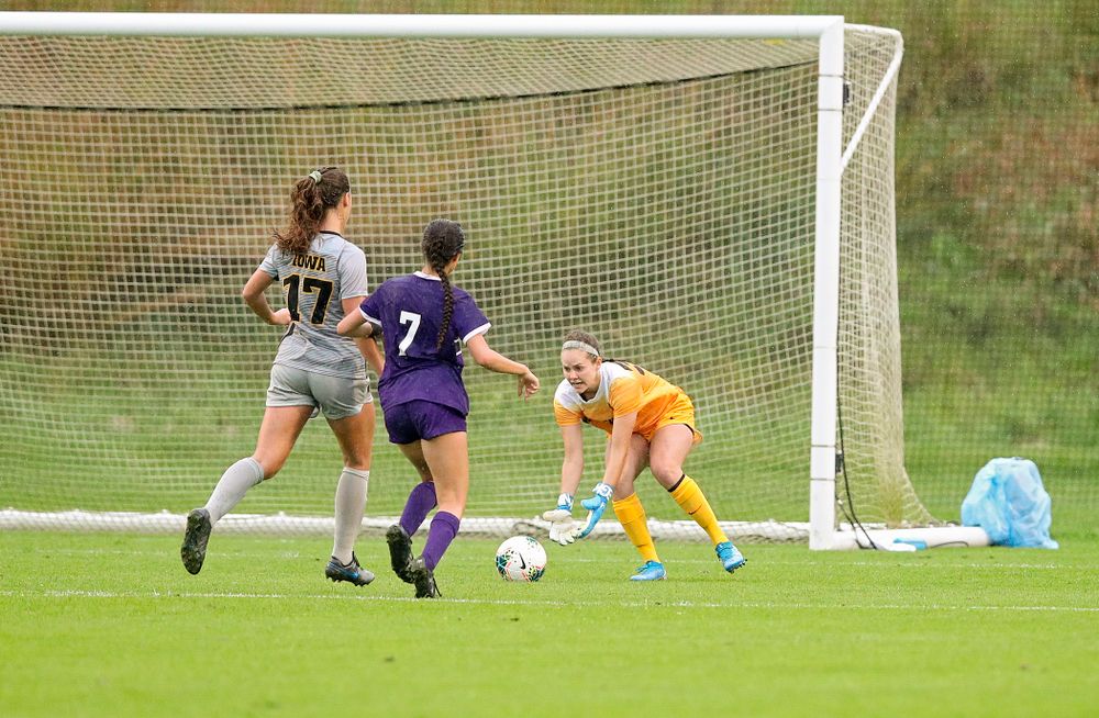 Iowa goalkeeper Claire Graves (34) scoops up a shot as defender Hannah Drkulec (17) closes in during the second half of their match at the Iowa Soccer Complex in Iowa City on Sunday, Sep 29, 2019. (Stephen Mally/hawkeyesports.com)