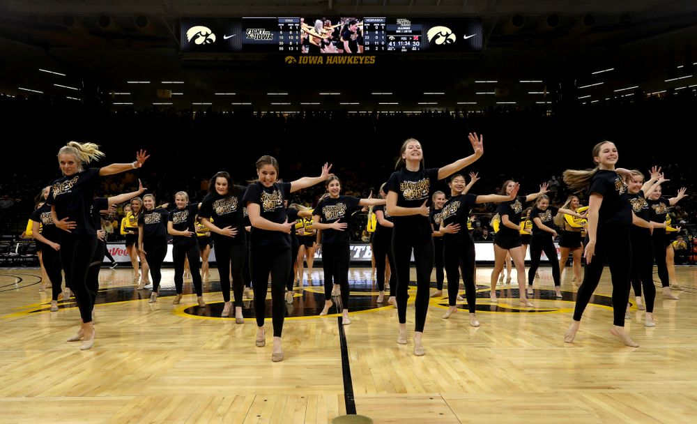 The Iowa Spirit Squad performs with participants in Spirit Squad Day at halftime of the Iowa Hawkeyes game against the Nebraska Cornhuskers Saturday, February 8, 2020 at Carver-Hawkeye Arena. (Brian Ray/hawkeyesports.com)