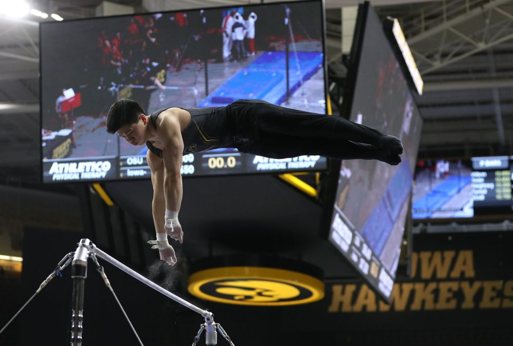Iowa's Bennet Huang competes on the high bar against the Ohio State Buckeyes Saturday, March 16, 2019 at Carver-Hawkeye Arena. (Brian Ray/hawkeyesports.com)