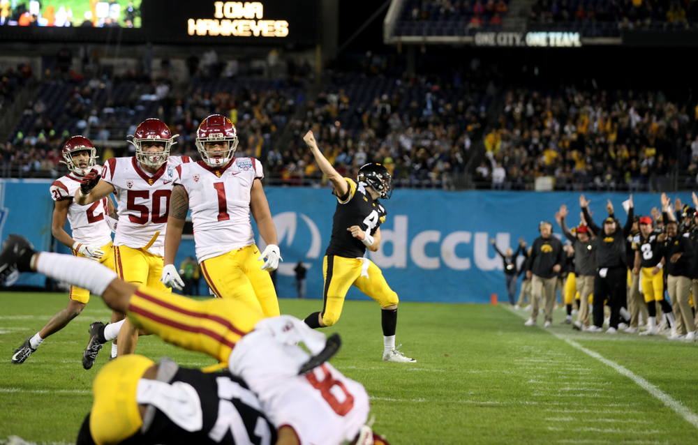 Iowa Hawkeyes quarterback Nate Stanley (4) celebrates a touchdown pass against USC in the Holiday Bowl Friday, December 27, 2019 at San Diego Community Credit Union Stadium. (Brian Ray/hawkeyesports.com)