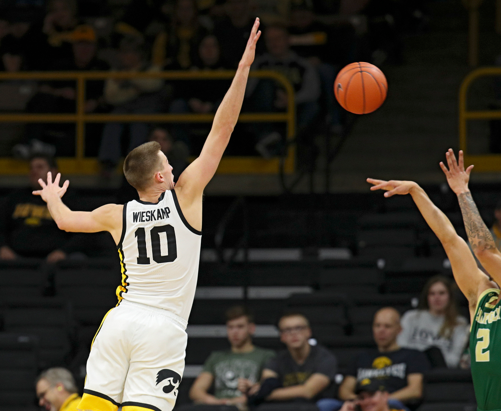 Iowa Hawkeyes guard Joe Wieskamp (10) blocks a shot by Cal Poly Mustangs forward Malek Harwell (2) during the second half of their game at Carver-Hawkeye Arena in Iowa City on Sunday, Nov 24, 2019. (Stephen Mally/hawkeyesports.com)