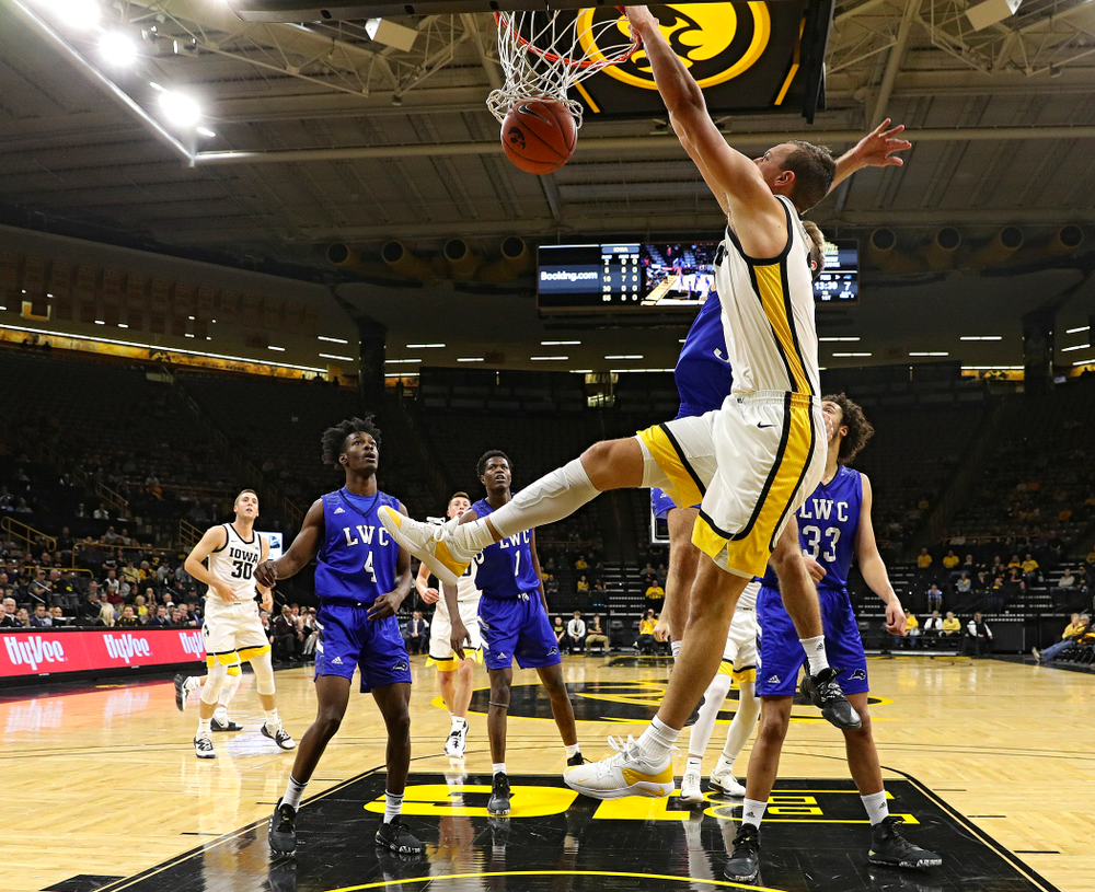 Iowa Hawkeyes forward Jack Nunge (2) dunks the ball during the first half of their exhibition game against Lindsey Wilson College at Carver-Hawkeye Arena in Iowa City on Monday, Nov 4, 2019. (Stephen Mally/hawkeyesports.com)