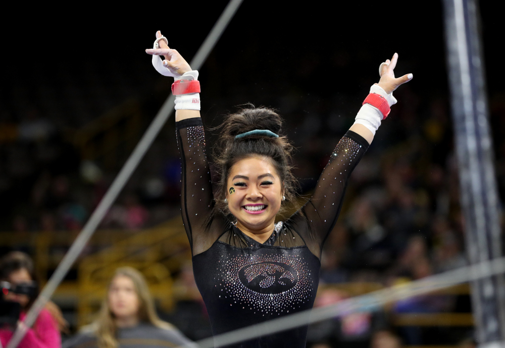 Iowa’s Clair Kaji competes on the bars against Michigan Friday, February 14, 2020 at Carver-Hawkeye Arena. (Brian Ray/hawkeyesports.com)