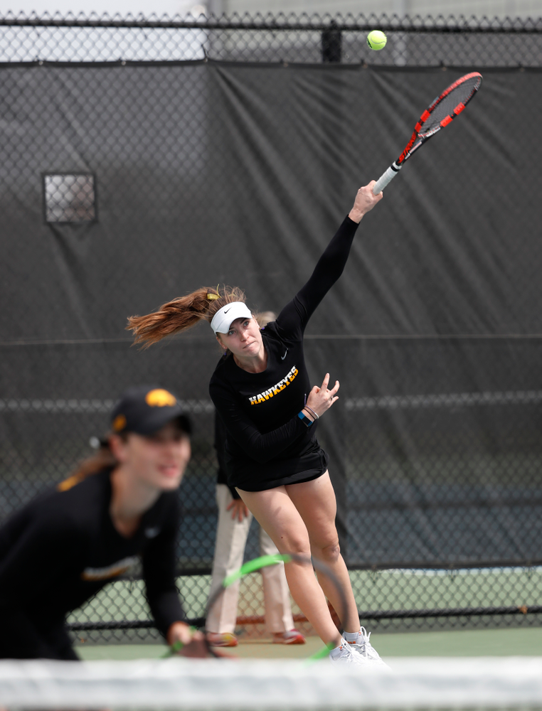 Elise Van Heuvelen and Anastasia Reimchen play a doubles match against the Wisconsin Badgers Sunday, April 22, 2018 at the Hawkeye Tennis and Recreation Center. (Brian Ray/hawkeyesports.com)