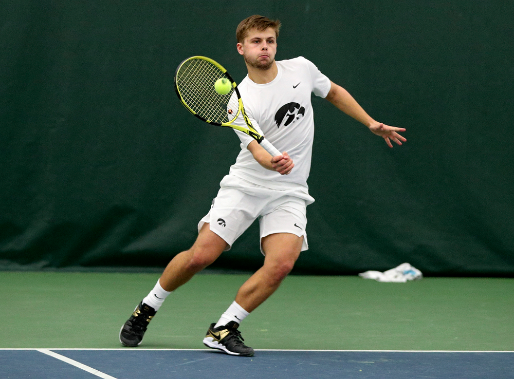 Iowa’s Will Davies returns a shot during his singles match at the Hawkeye Tennis and Recreation Complex in Iowa City on Sunday, February 16, 2020. (Stephen Mally/hawkeyesports.com)