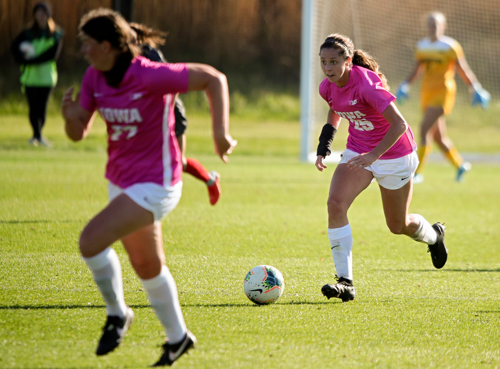 Iowa midfielder Josie Durr (25) moves down the field with forward Samantha Tawharu (27) during the second overtime of their match at the Iowa Soccer Complex in Iowa City on Sunday, Oct 27, 2019. (Stephen Mally/hawkeyesports.com)