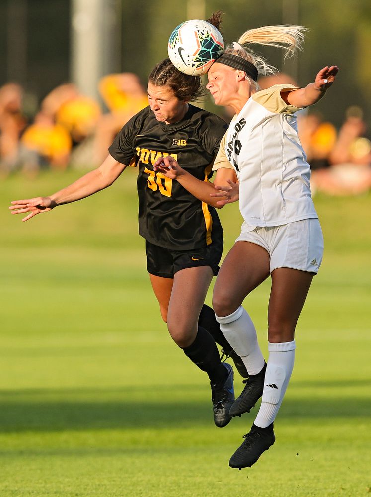 Iowa forward Devin Burns (30) battles for a header during the first half of their match against Western Michigan at the Iowa Soccer Complex in Iowa City on Thursday, Aug 22, 2019. (Stephen Mally/hawkeyesports.com)