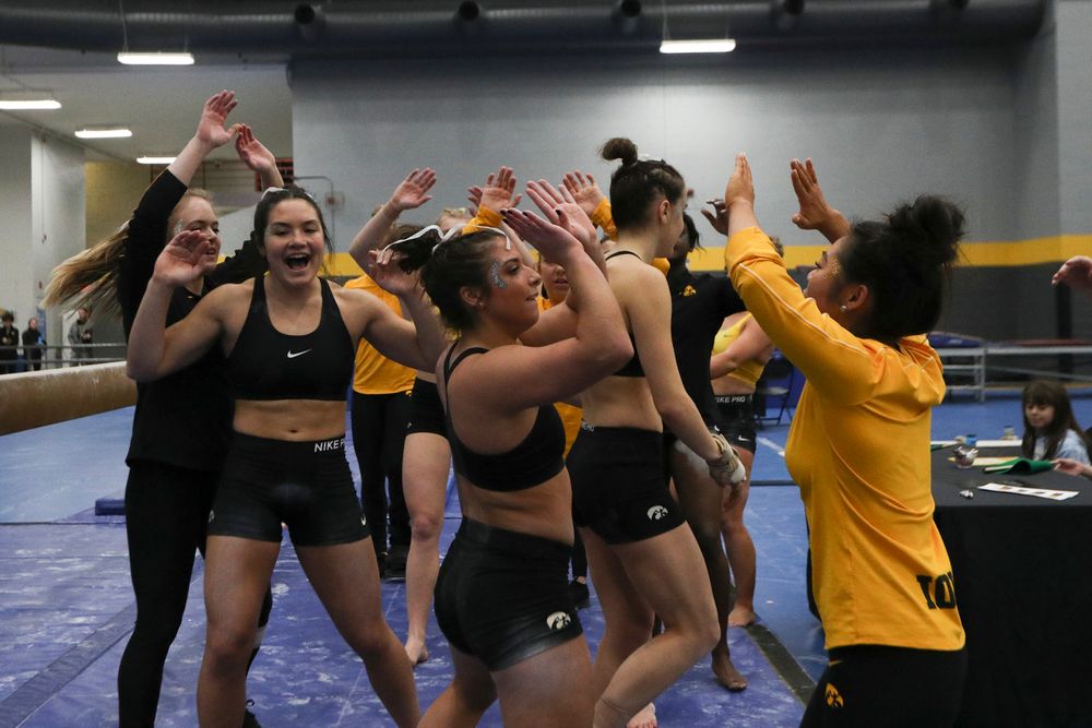 Ariana Agrapides (center) high fives teammates during the Iowa women’s gymnastics Black and Gold Intraquad Meet on Saturday, December 7, 2019 at the UI Field House. (Lily Smith/hawkeyesports.com)