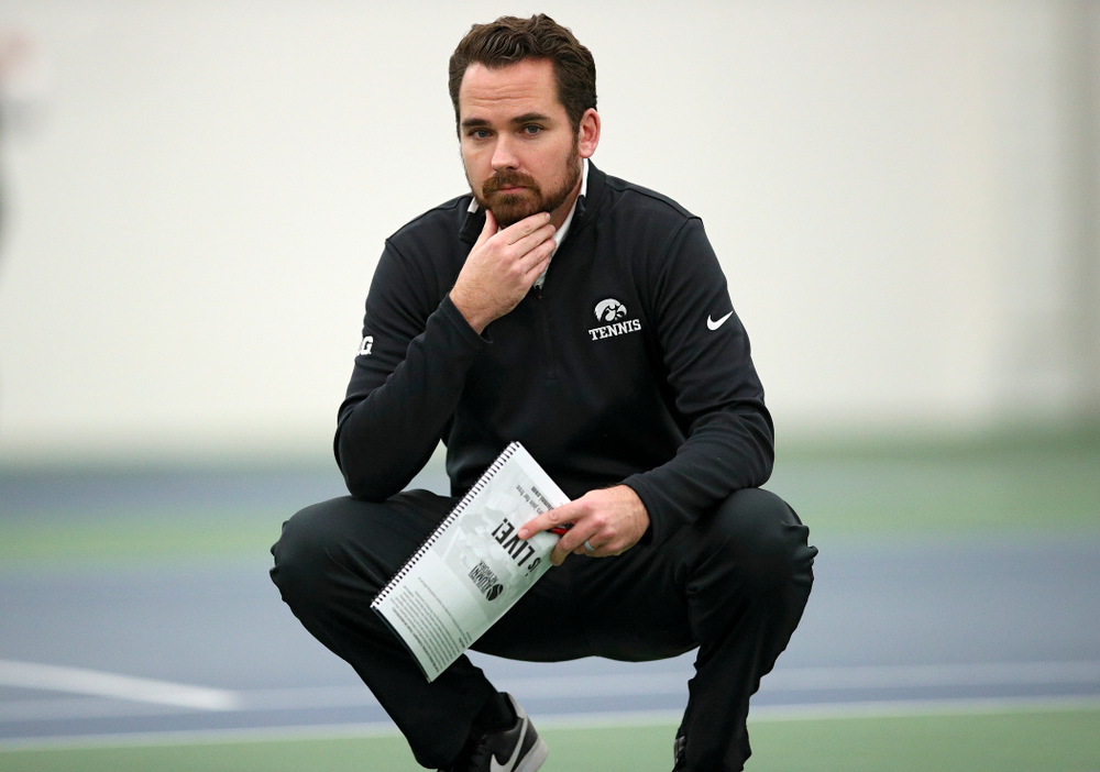Iowa head coach Ross Wilson looks on during their match at the Hawkeye Tennis and Recreation Complex in Iowa City on Thursday, January 16, 2020. (Stephen Mally/hawkeyesports.com)