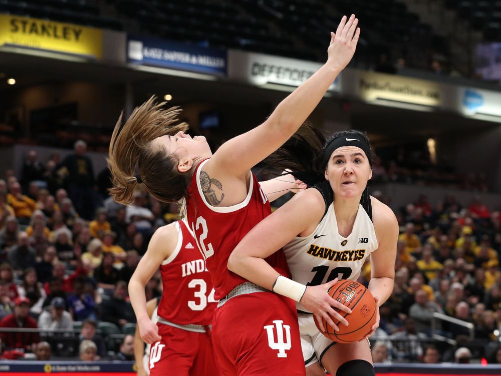 Iowa Hawkeyes forward Megan Gustafson (10) draws a foul on her way to making a basket against the Indiana Hoosiers in the quarterfinals of the Big Ten Tournament Friday, March 8, 2019 at Bankers Life Fieldhouse in Indianapolis, Ind. (Brian Ray/hawkeyesports.com)