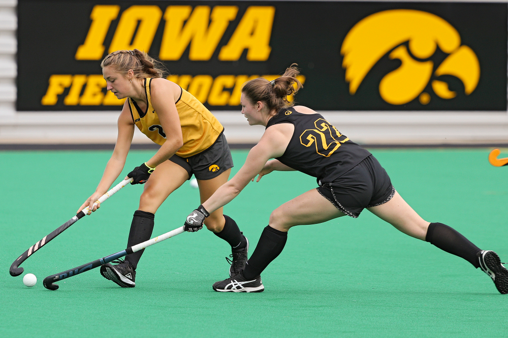 Iowa’s Emily Deuell (2) and Ellie Flynn (22) run a drill during practice at Grant Field in Iowa City on Thursday, Aug 15, 2019. (Stephen Mally/hawkeyesports.com)