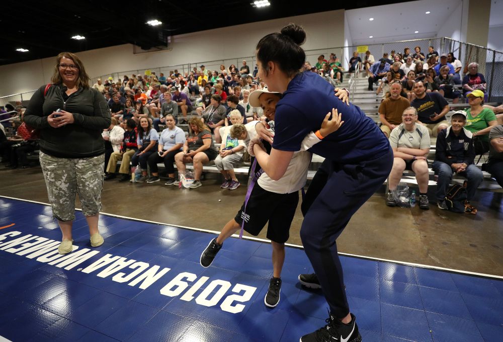 Iowa Hawkeyes forward Megan Gustafson (10) hugs a young fan at the Tourney Town Fan Fest Friday, April 5, 2019 at the Tampa Convention Center in Tampa, FL. (Brian Ray/hawkeyesports.com)