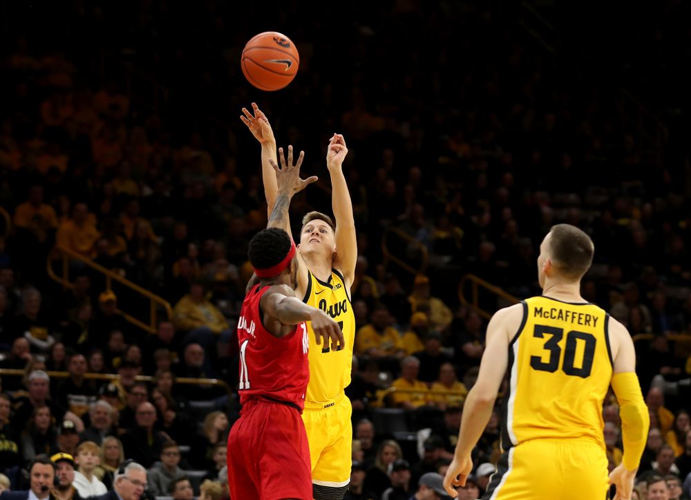 Iowa Hawkeyes guard Austin Ash (13) knocks down a three point basket against the Nebraska Cornhuskers Saturday, February 8, 2020 at Carver-Hawkeye Arena. (Brian Ray/hawkeyesports.com)