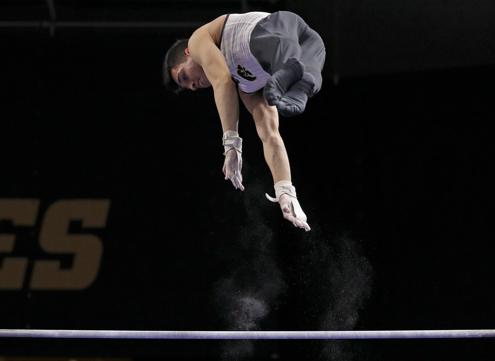 Iowa's Andrew Herrador competes in the parallel bars during the second day of the Big Ten Men's Gymnastics Championships at Carver-Hawkeye Arena in Iowa City on Saturday, Apr. 6, 2019. (Stephen Mally/hawkeyesports.com)