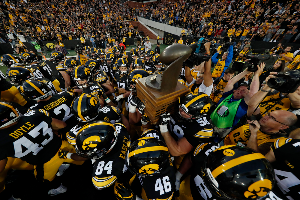 The Iowa Hawkeyes celebrate with the Cy-Hawk trophy following their game against the Iowa State Cyclones Saturday, September 8, 2018 at Kinnick Stadium. (Brian Ray/hawkeyesports.com)
