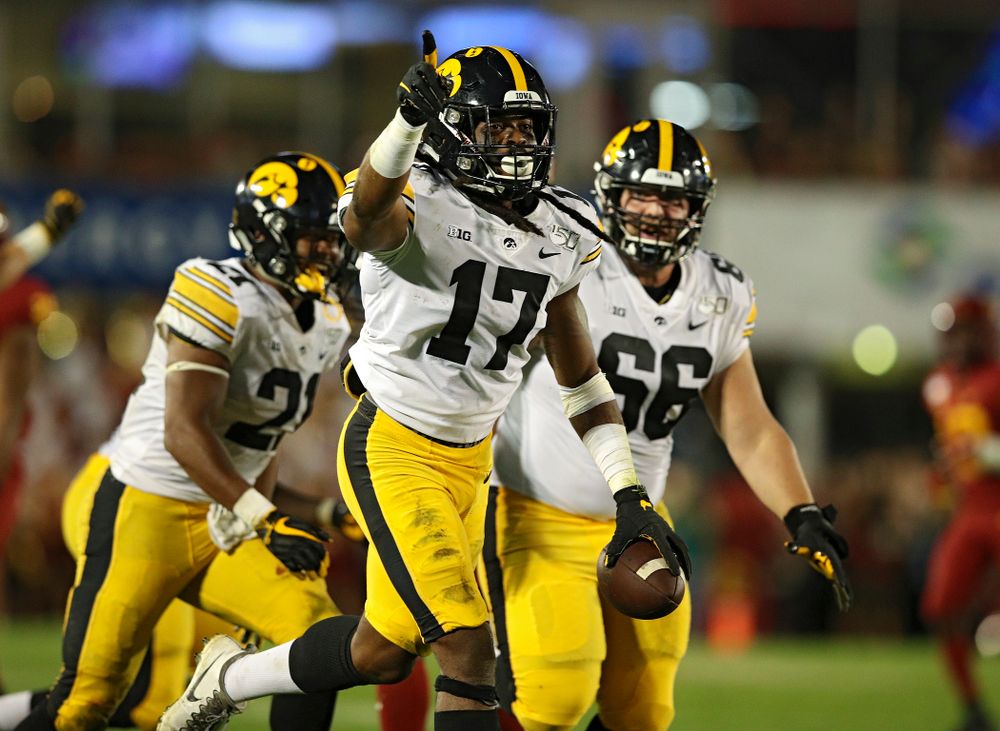 Iowa Hawkeyes defensive back Devonte Young (17) celebrates his fumble recovery with running back Ivory Kelly-Martin (21) and defensive lineman Dalles Jacobus (66) during the fourth quarter of their Iowa Corn Cy-Hawk Series game at Jack Trice Stadium in Ames on Saturday, Sep 14, 2019. (Stephen Mally/hawkeyesports.com)